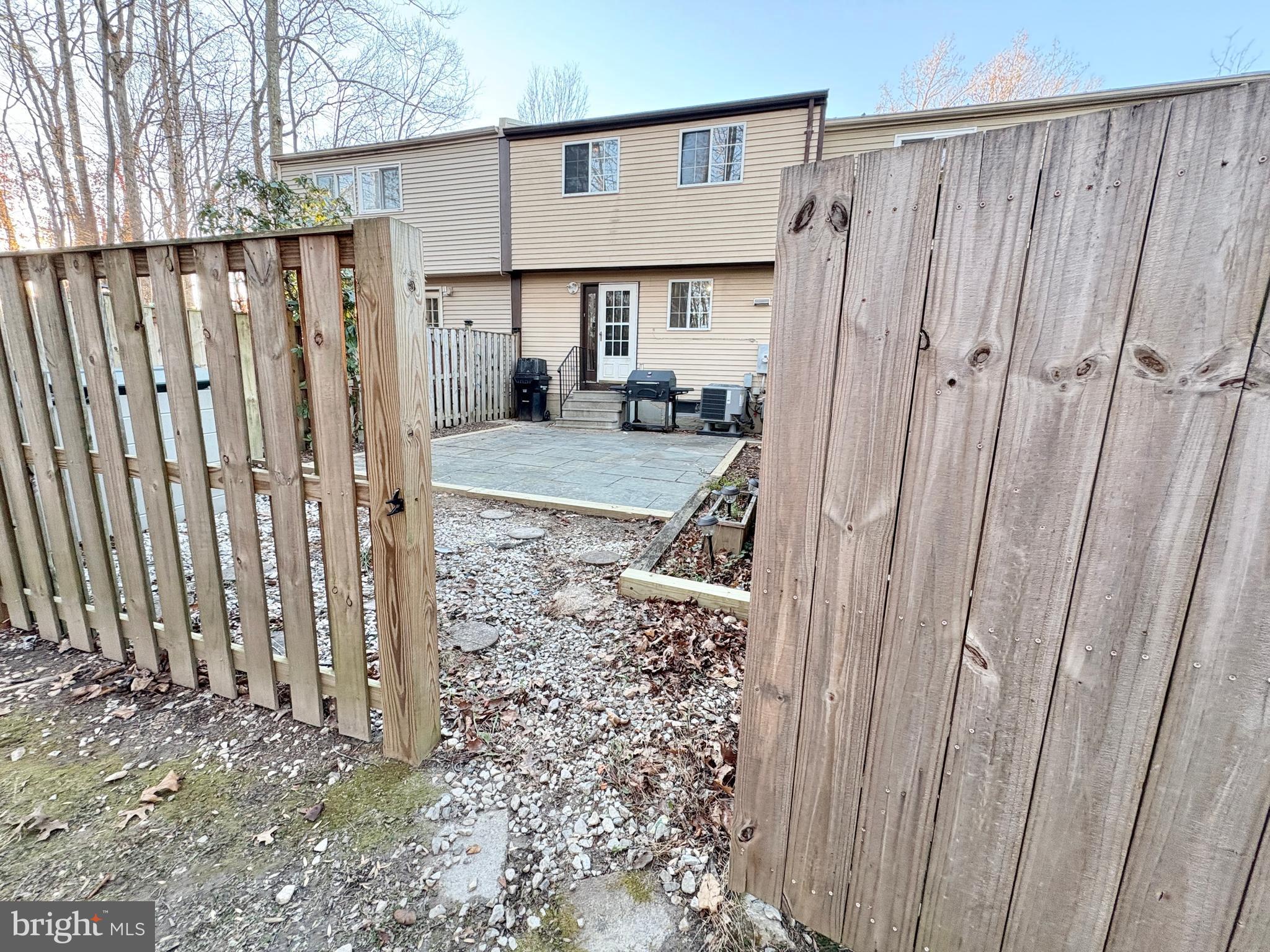 8263 Burning Forest Court Springfield, VA 22153 - Photo 37 of 43 a view of a house with backyard and porch