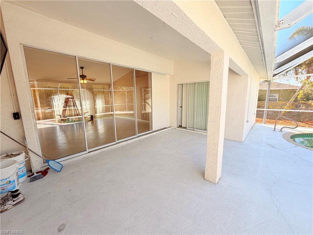 8397 Bahamas Road Fort Myers, FL 33967 - Photo 28 of 37 View of patio / terrace with a ceiling fan and glass enclosure
