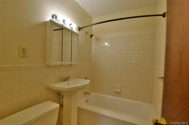 a bathroom with a sink and shower