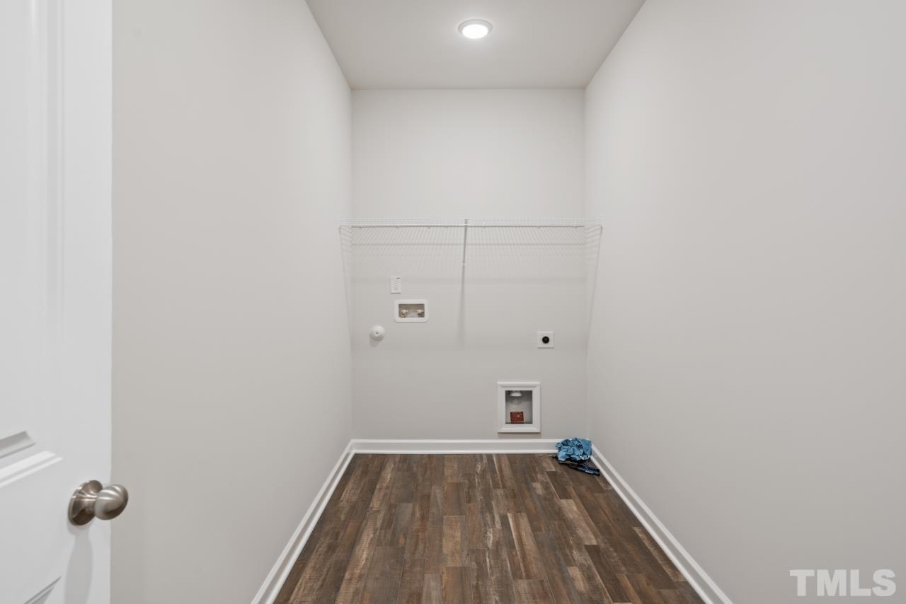 129 Scoville Road Garner, NC 27529 - Photo 15 of 25 a view of a room with wooden floor