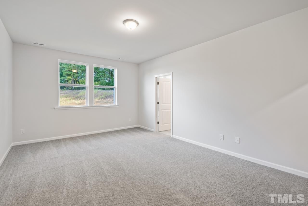 129 Scoville Road Garner, NC 27529 - Photo 16 of 25 an empty room with windows