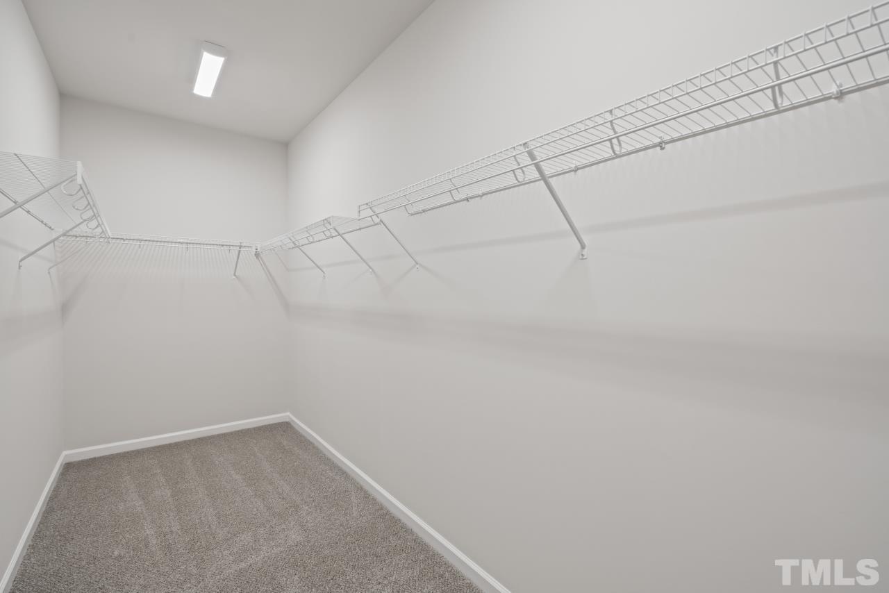 129 Scoville Road Garner, NC 27529 - Photo 20 of 25 a view of a room with racks on the wall