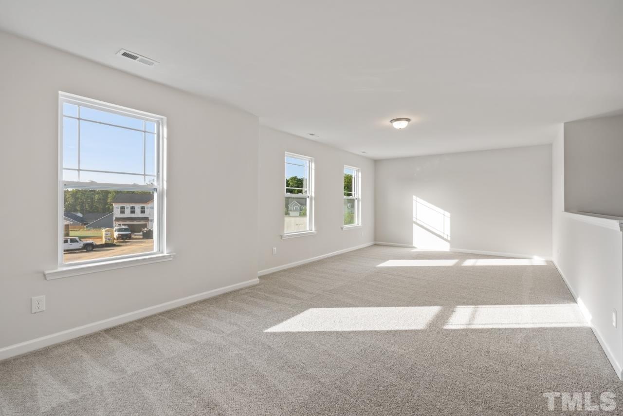 129 Scoville Road Garner, NC 27529 - Photo 23 of 25 a view of an empty room with a window