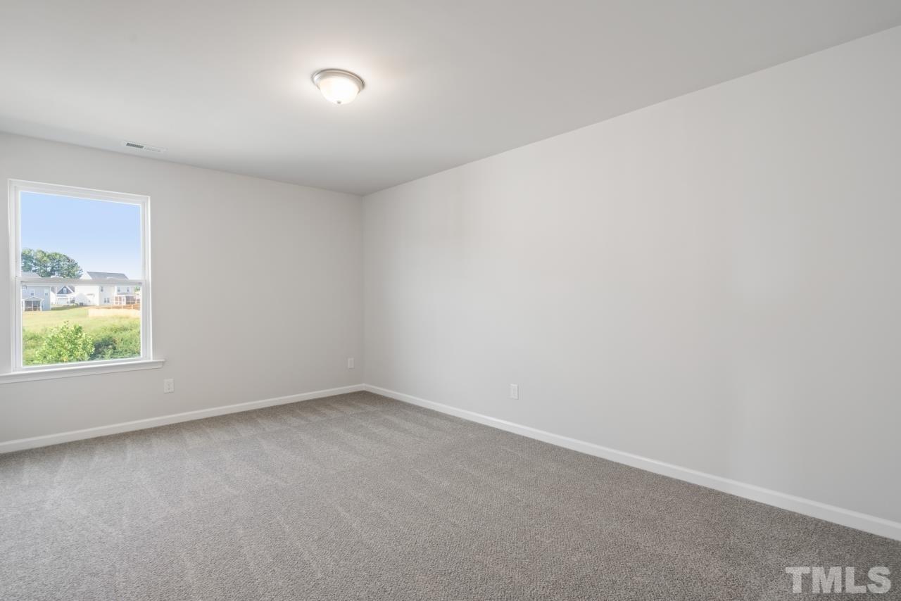 129 Scoville Road Garner, NC 27529 - Photo 24 of 25 an empty room with a window