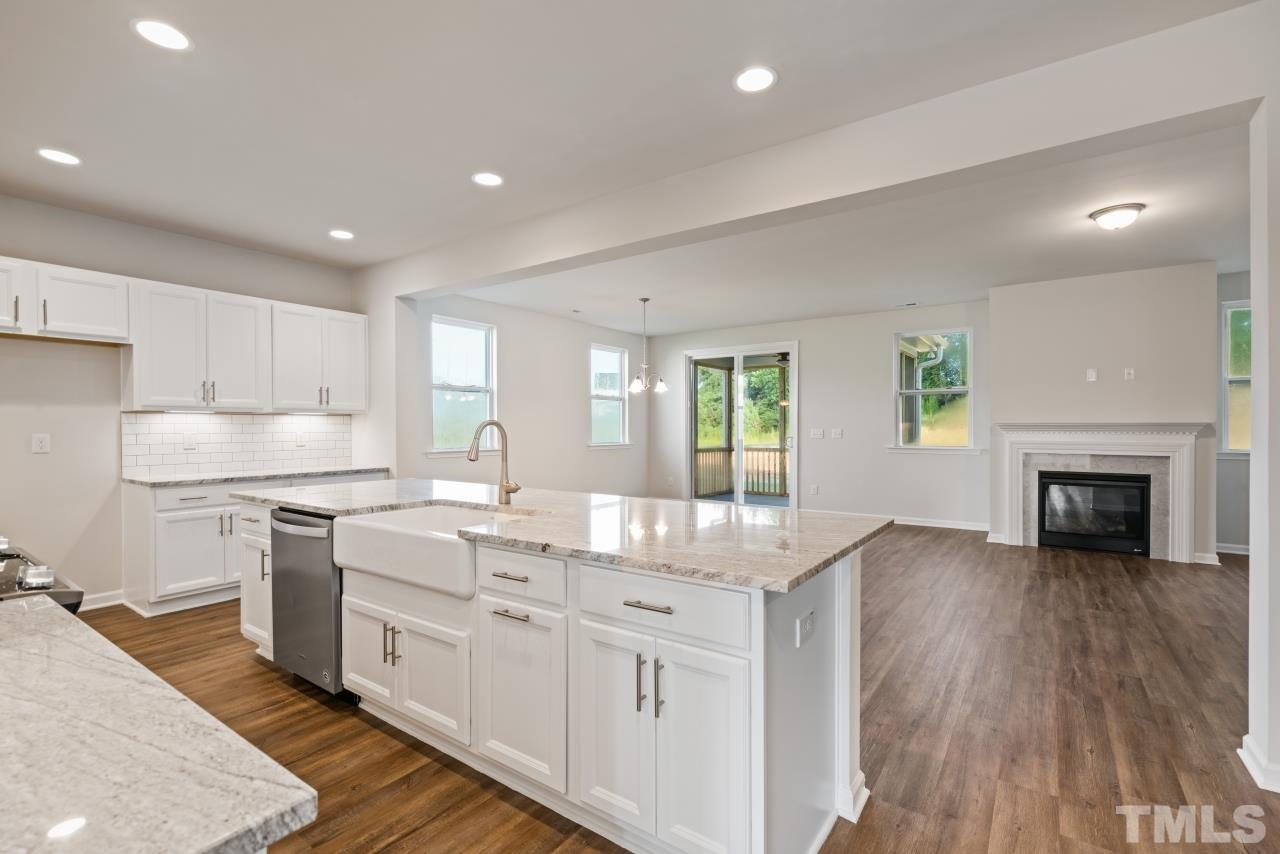 129 Scoville Road Garner, NC 27529 - Photo 5 of 25 a kitchen with a sink window and cabinets
