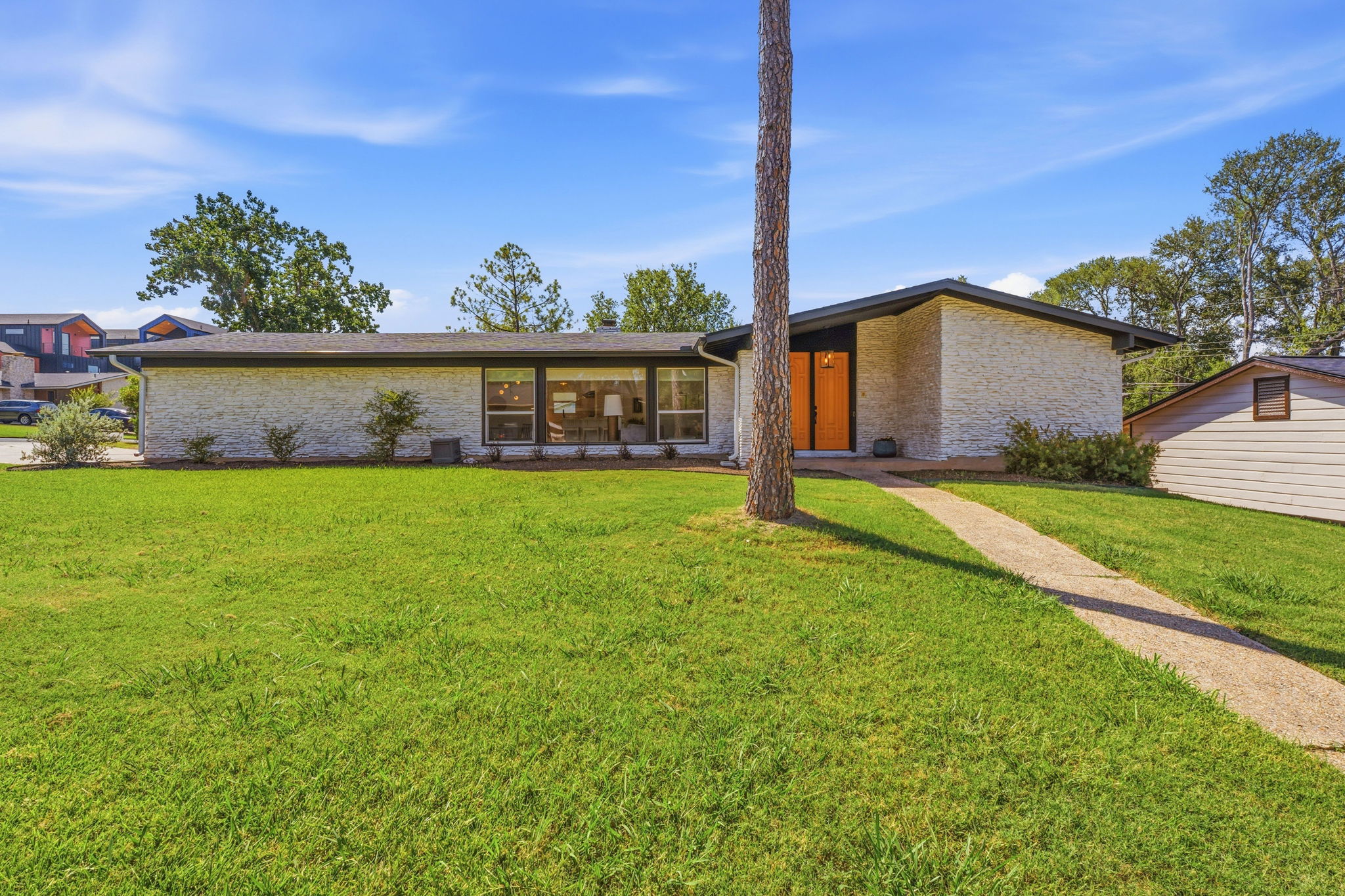 4403 Elmsgrove Drive Austin, TX 78721 - Photo 17 of 38 Clean lines and a striking stone facade define this mid-century modern residence.
