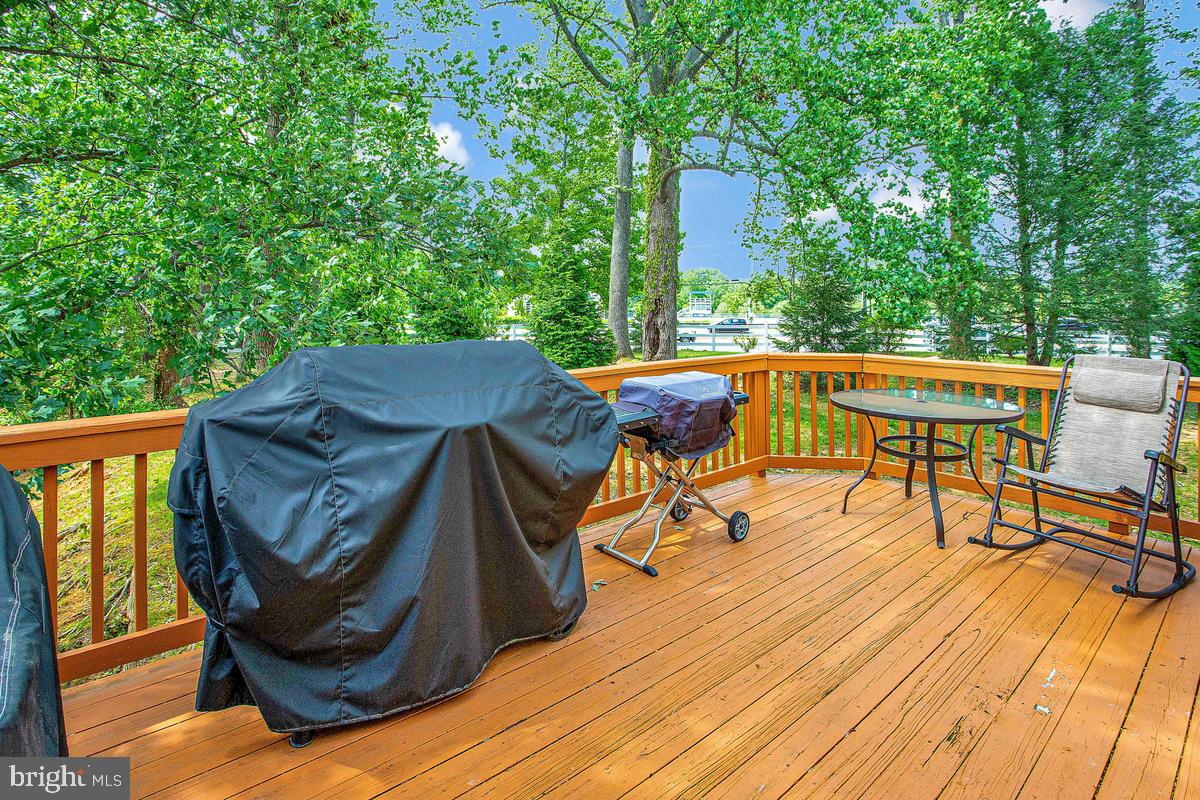 648 Howards Loop, Unit 19 Annapolis, MD 21401 - Photo 7 of 35 Serene deck surrounded by lush greenery.