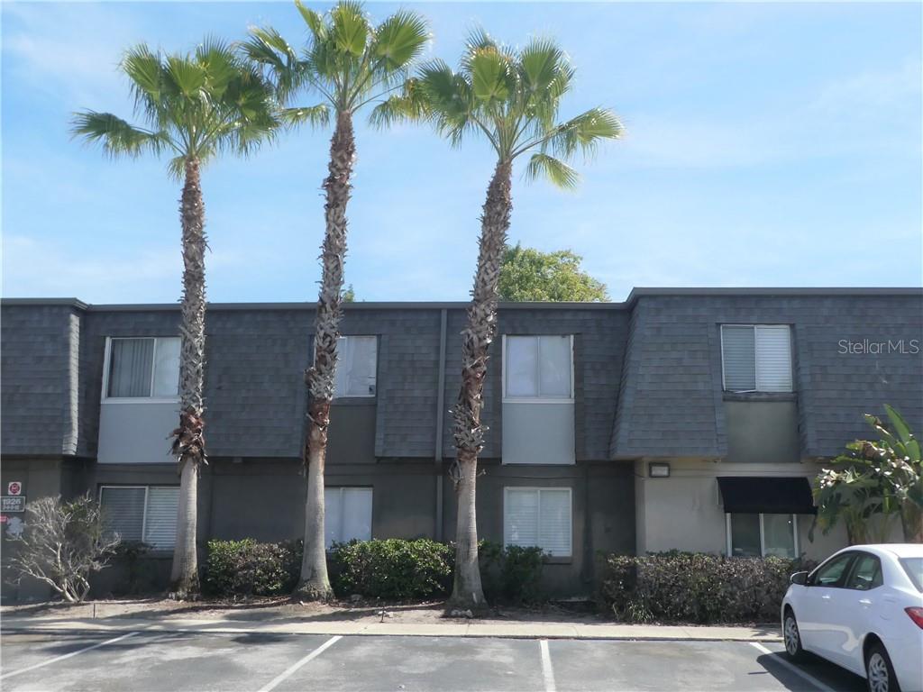 1916 South Conway Road, Unit 7 Orlando, FL 32812 - Photo 1 of 1 a view of multiple houses with palm trees
