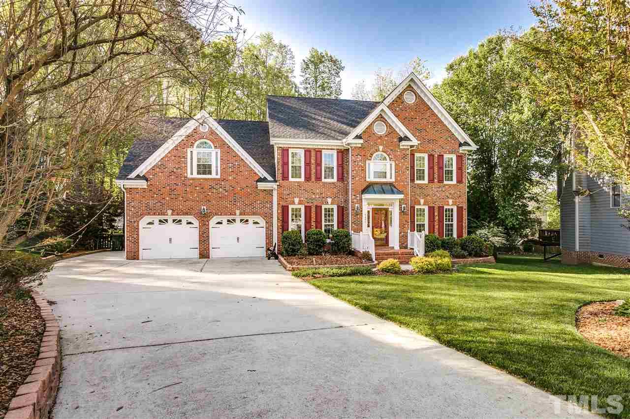 9401 Floral Ridge Court Raleigh, NC 27613 - Photo 3 of 25 a front view of a house with a yard