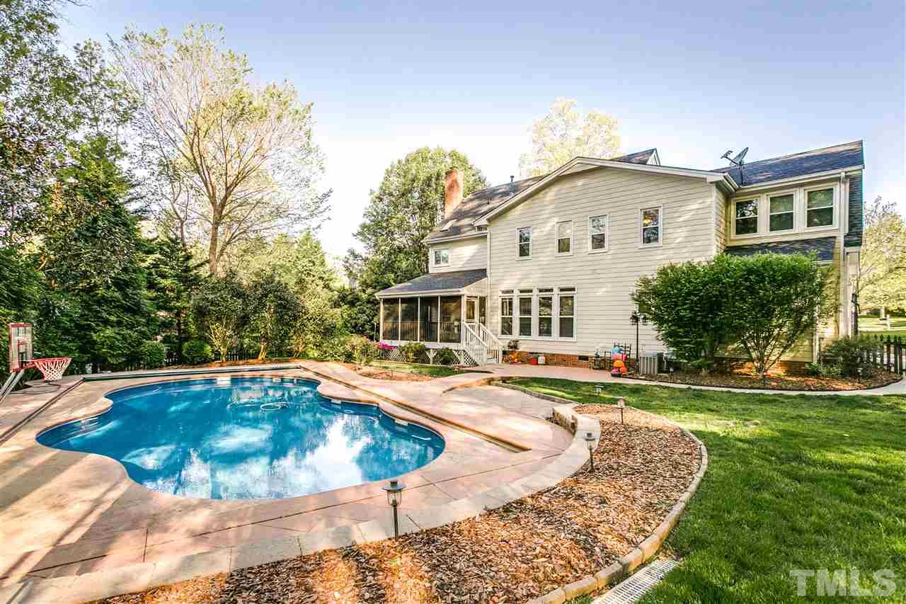 9401 Floral Ridge Court Raleigh, NC 27613 - Photo 23 of 25 a view of a house with swimming pool and sitting area