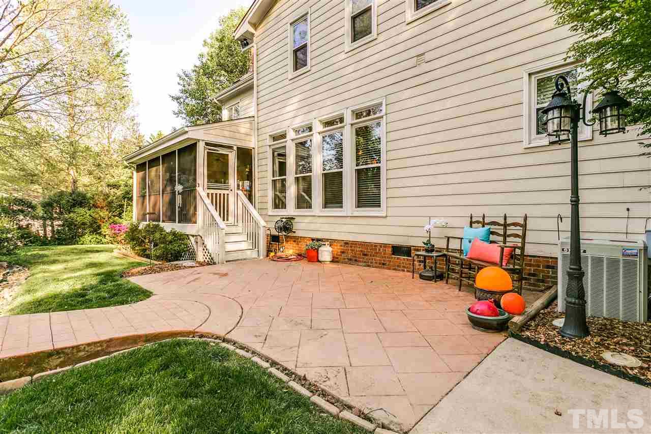 9401 Floral Ridge Court Raleigh, NC 27613 - Photo 24 of 25 a view of a house with backyard and sitting area
