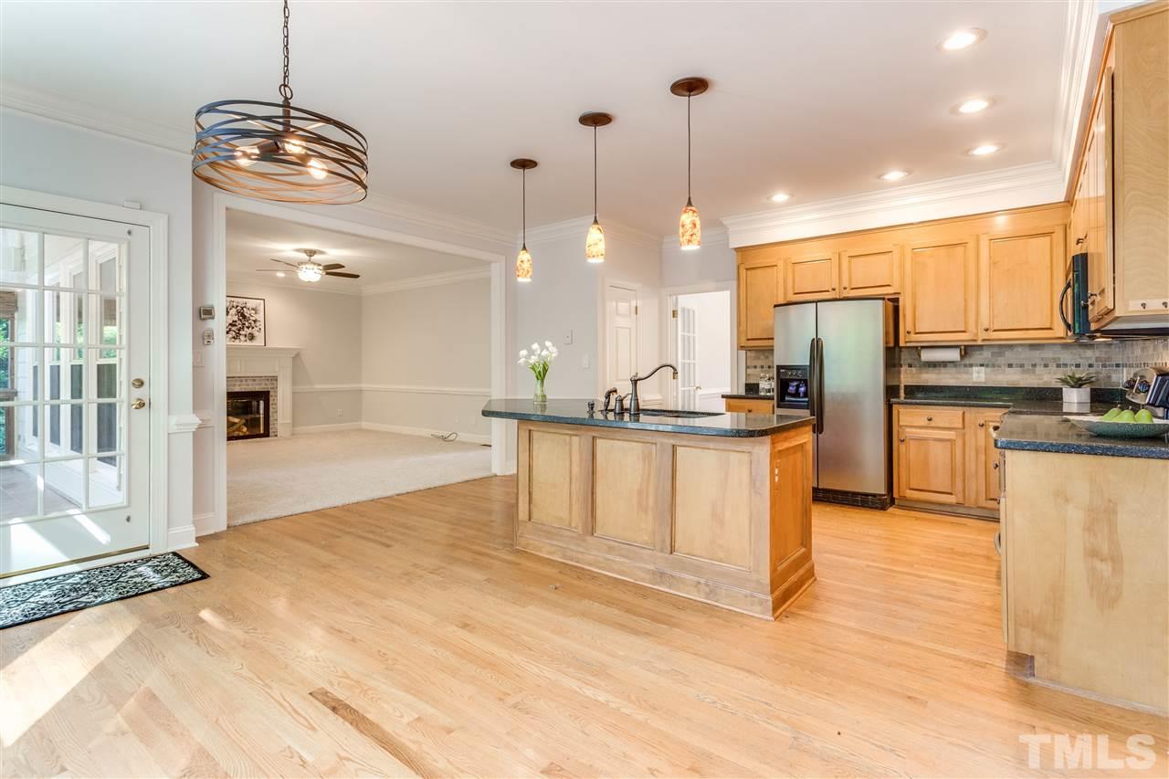 9401 Floral Ridge Court Raleigh, NC 27613 - Photo 10 of 25 a large kitchen with lots of counter space and appliances