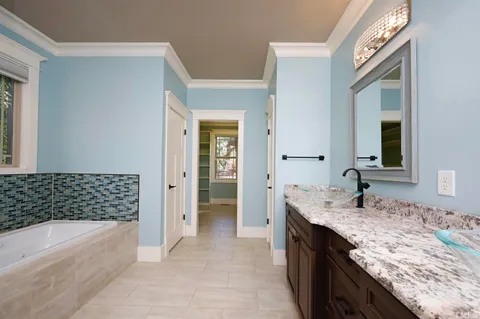 a view of room with cabinets and a window