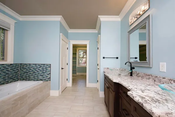 a view of room with cabinets and a window