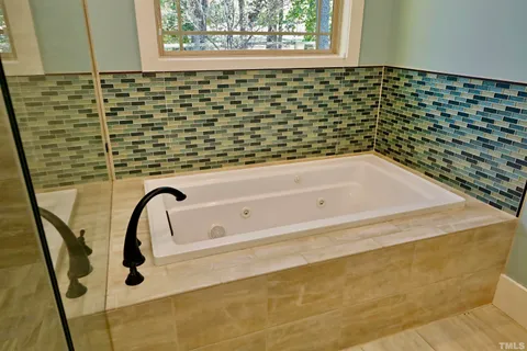 a front view of a house with swimming pool and porch