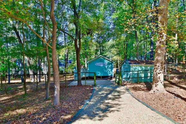 a view of a livingroom with wooden floor and closet
