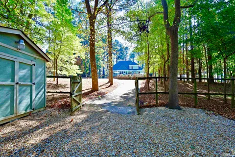 a backyard of a house with lots of green space