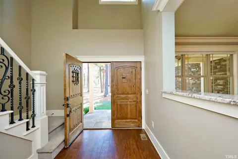 a view of a hallway view with wooden floor and staircase