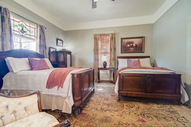 a bedroom with bed and window