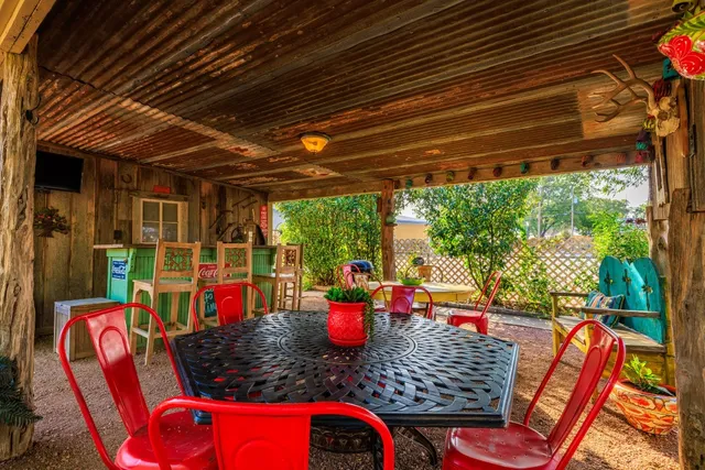 a outdoor dining space with furniture and garden view