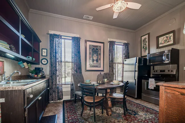a dining room with furniture and window