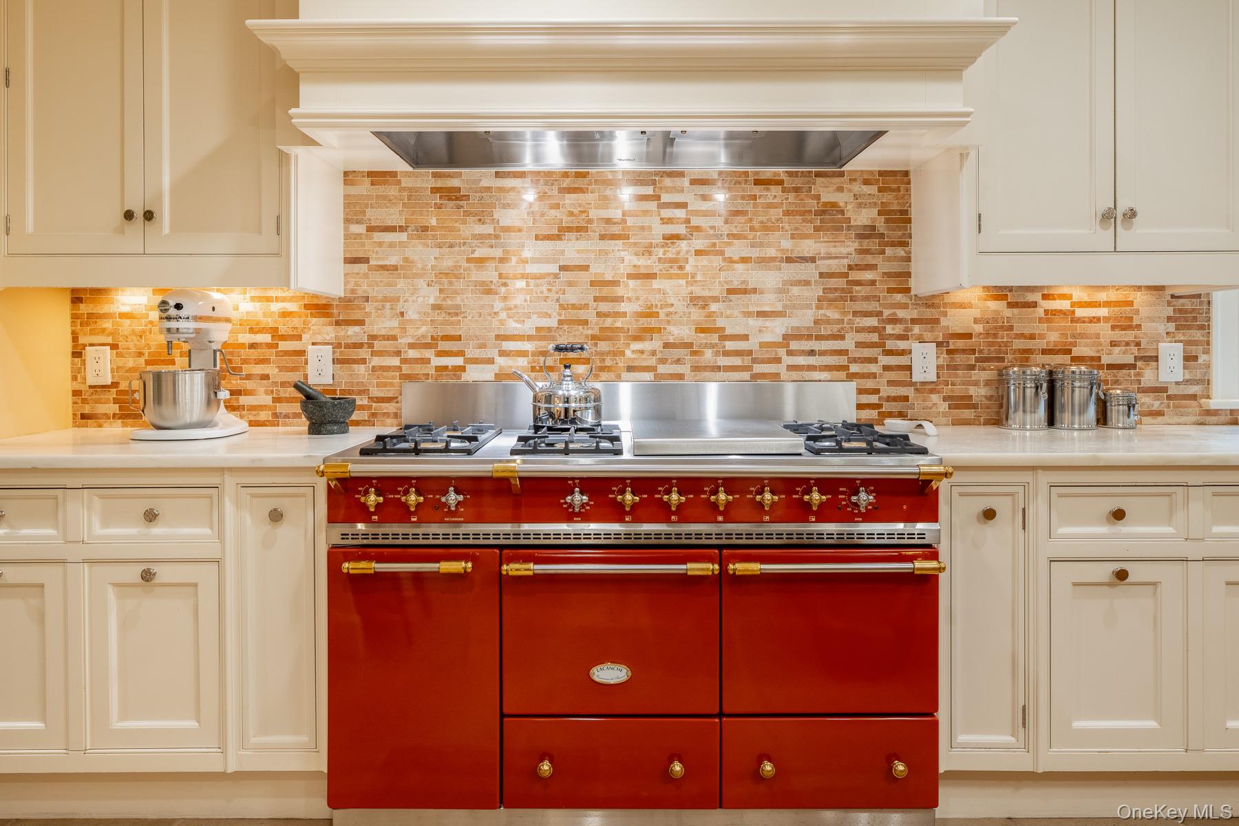 24 Homesdale Road Bronxville, NY 10708 - Photo 8 of 35 a kitchen with granite countertop cabinets and a stove