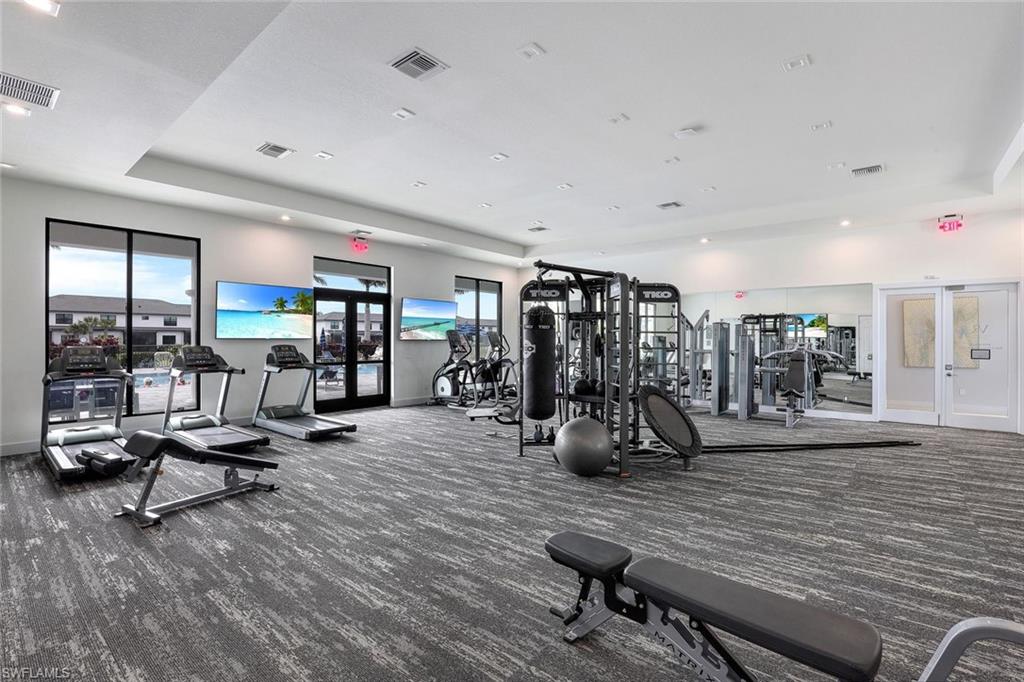 7473 Rockefeller Drive Naples, FL 34119 - Photo 18 of 19 a view of a room with gym equipment