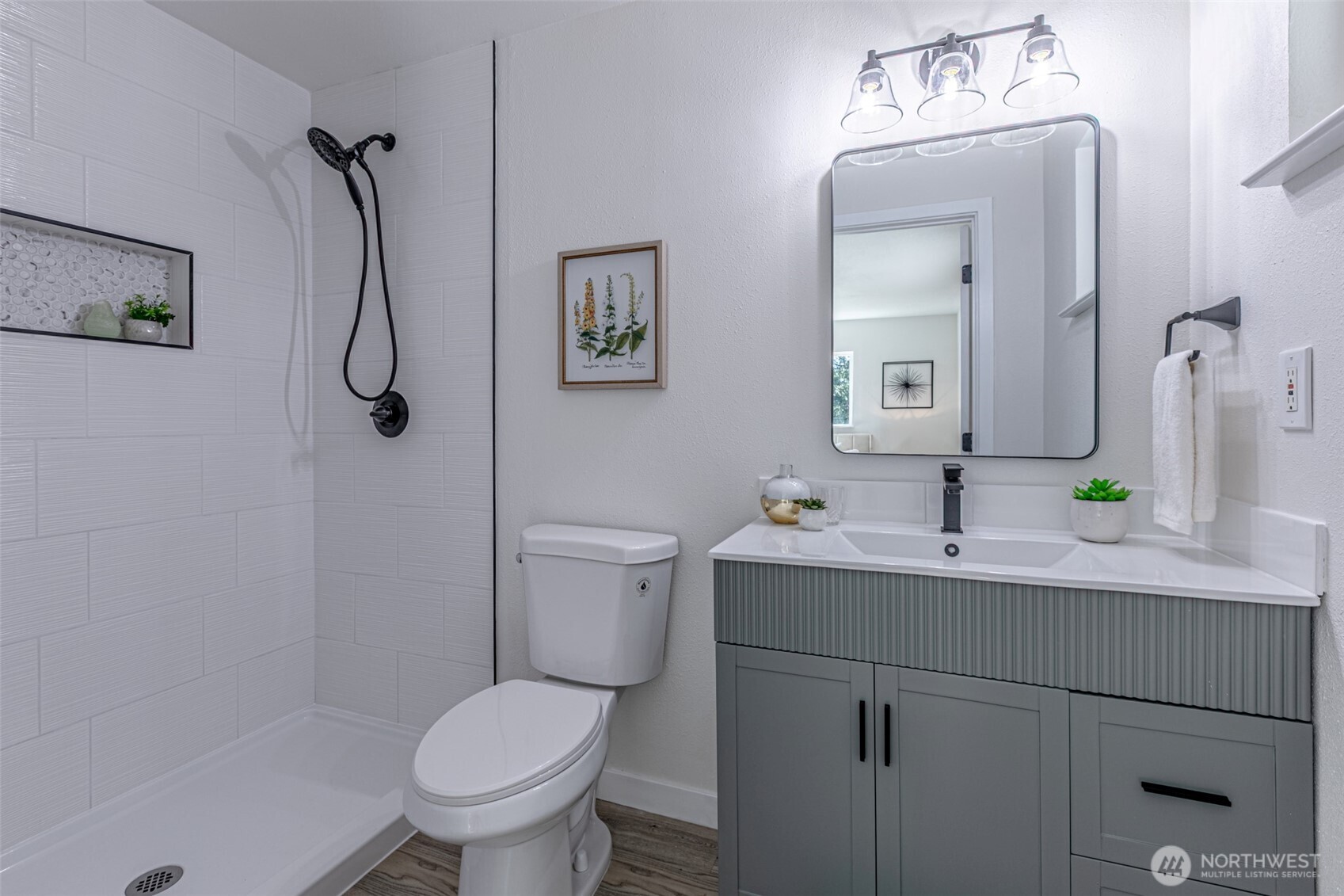 14224 180th Avenue Southeast Renton, WA 98059 - Photo 18 of 26 a bathroom with a toilet sink and mirror