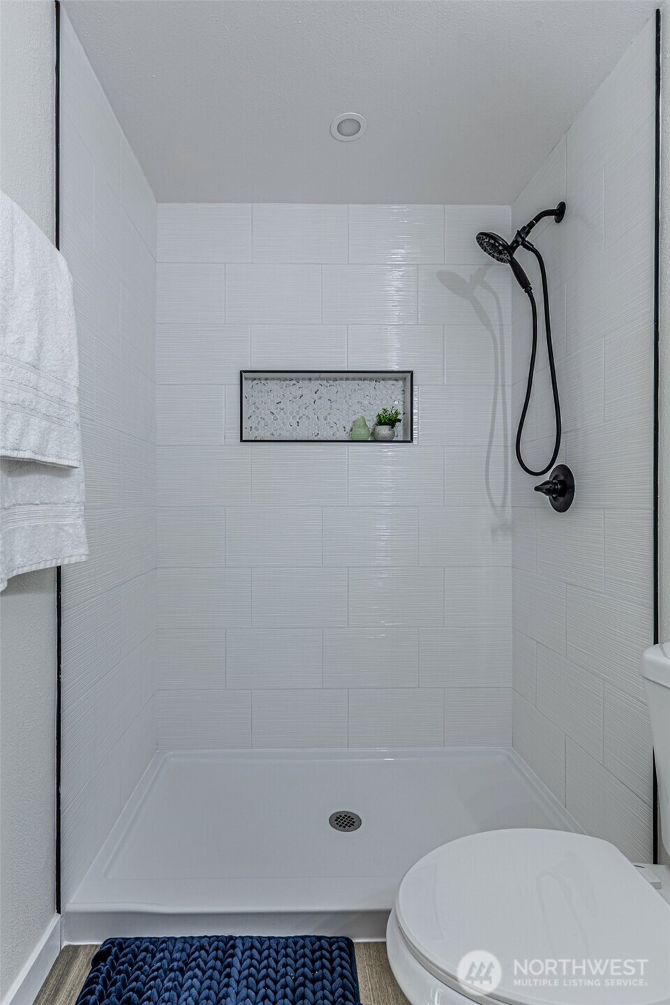 14224 180th Avenue Southeast Renton, WA 98059 - Photo 19 of 26 a white toilet sitting next to a shower