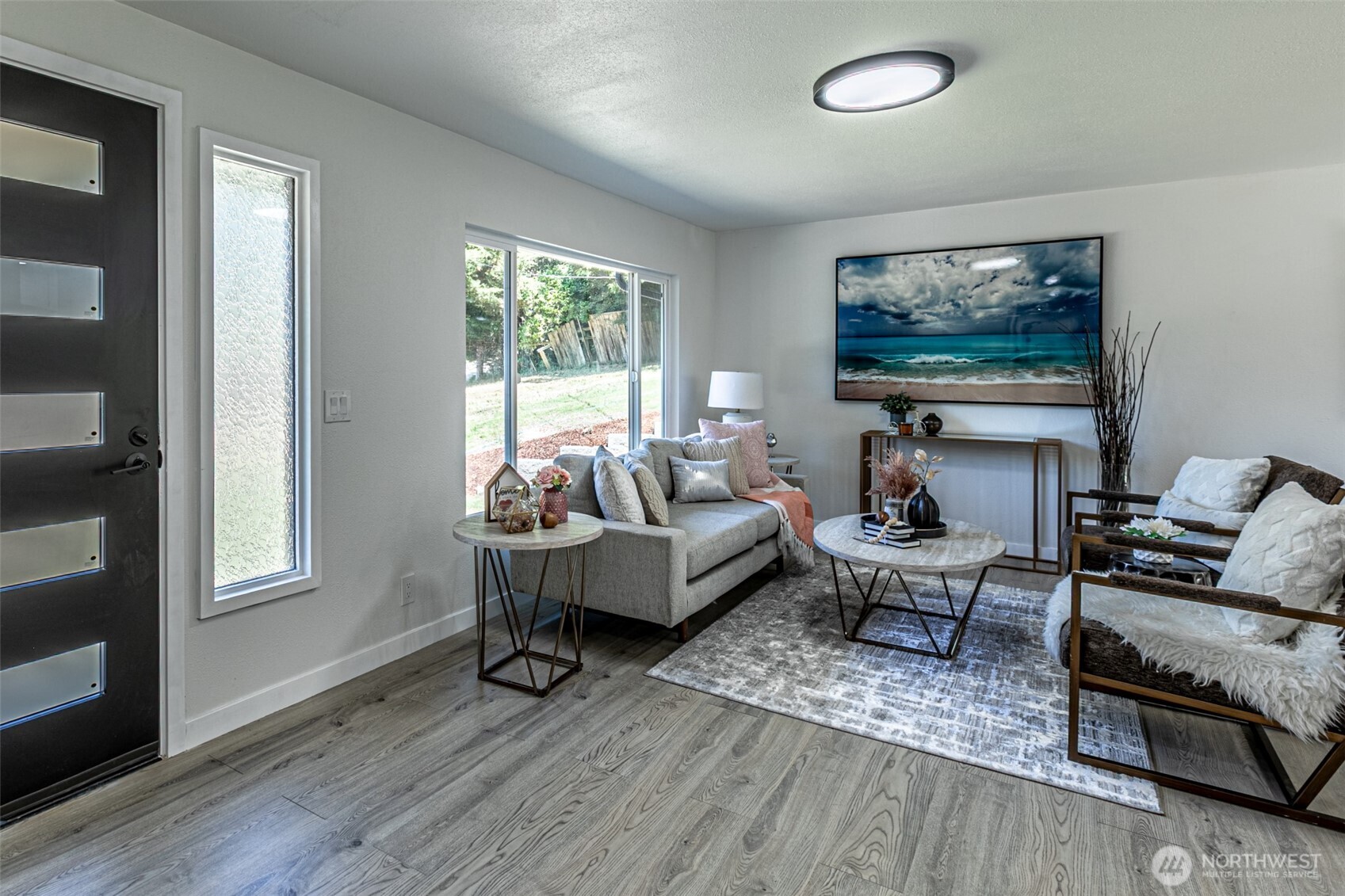 14224 180th Avenue Southeast Renton, WA 98059 - Photo 20 of 26 a living room with furniture a flat screen tv and a window