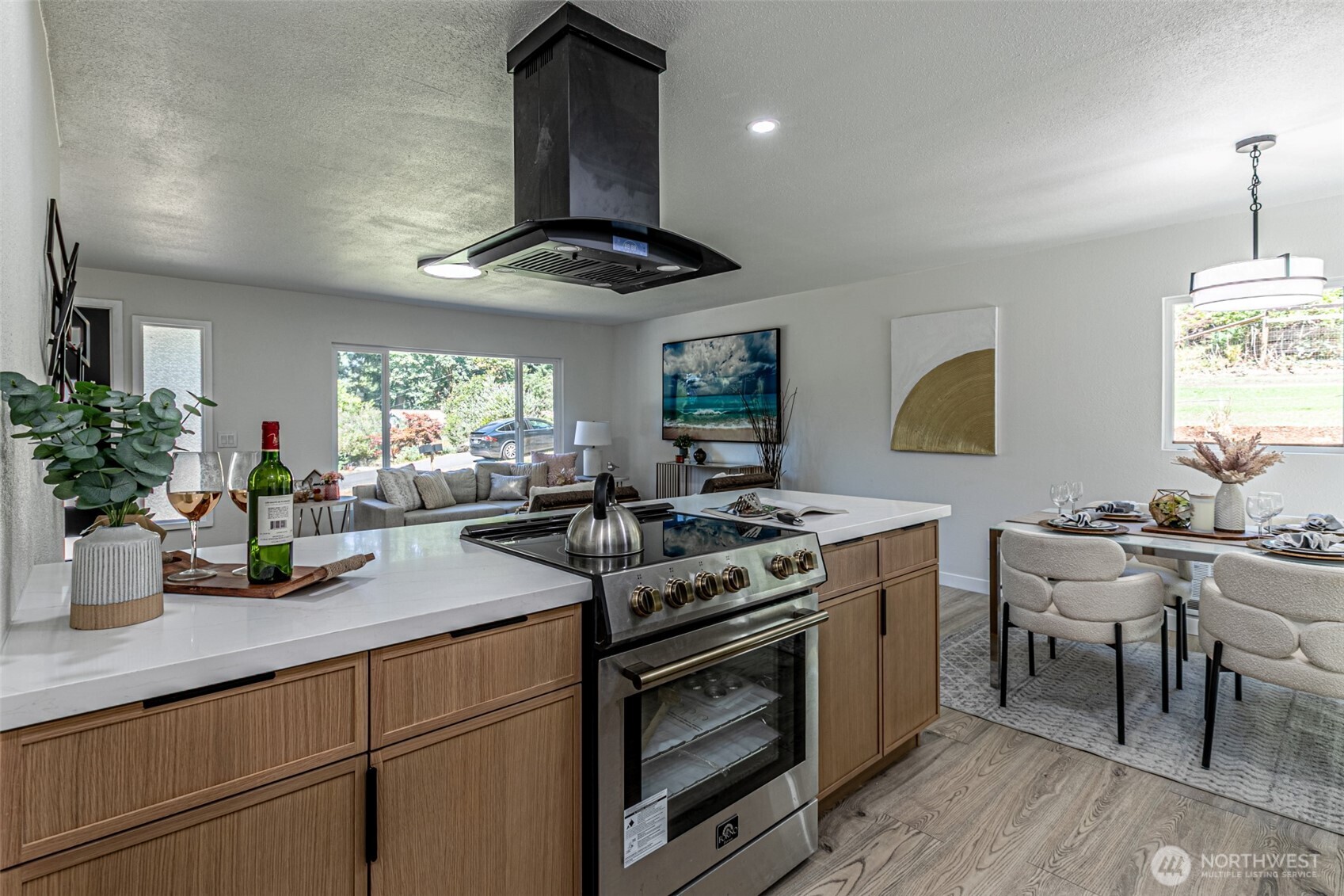 14224 180th Avenue Southeast Renton, WA 98059 - Photo 7 of 26 a kitchen with a stove and a white cabinets