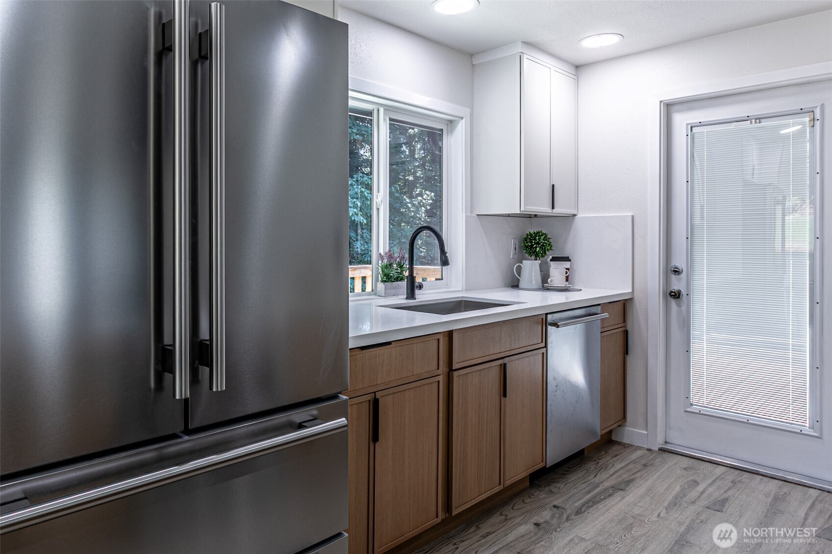 14224 180th Avenue Southeast Renton, WA 98059 - Photo 8 of 26 a bathroom with a sink a mirror and a window