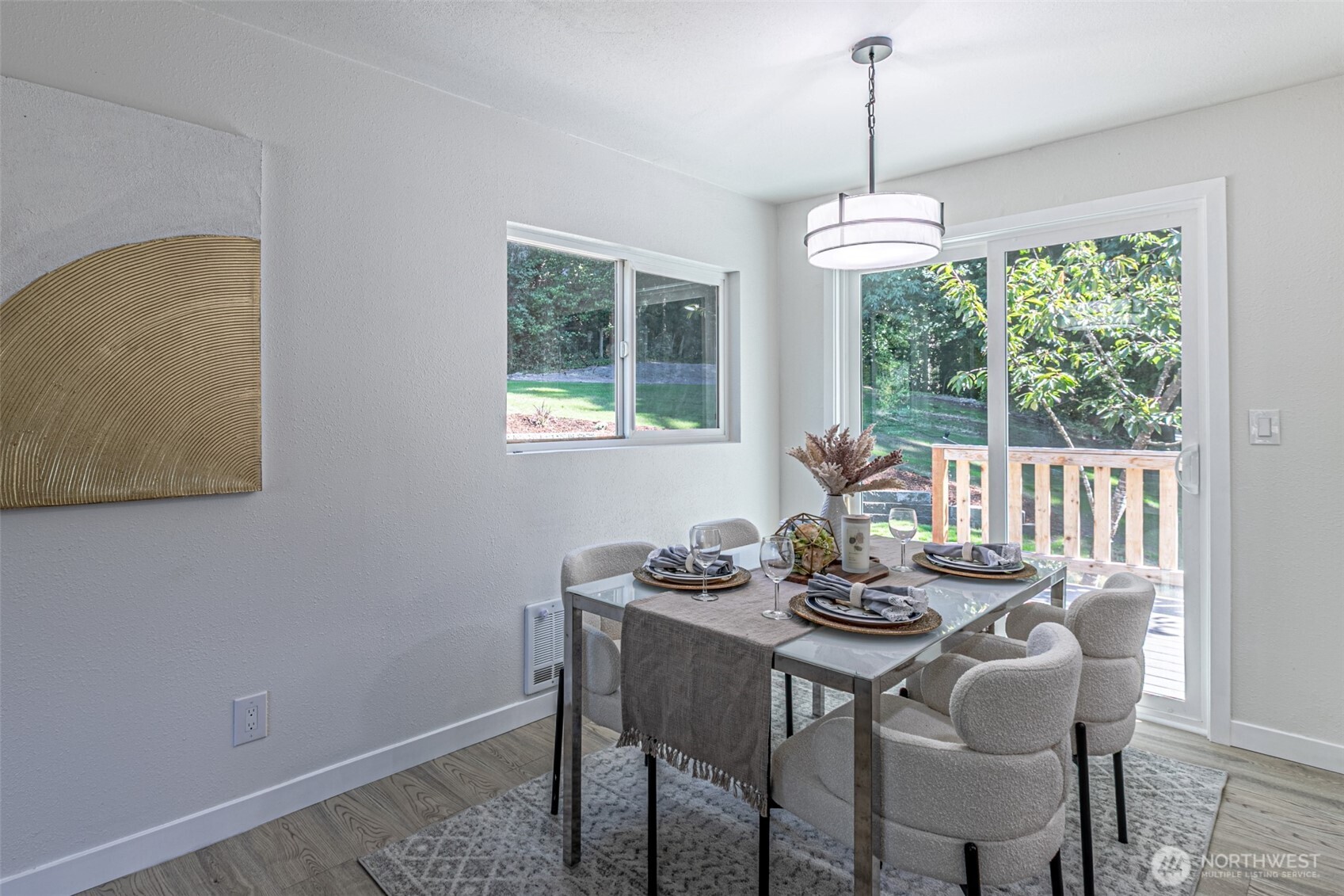14224 180th Avenue Southeast Renton, WA 98059 - Photo 9 of 26 a dining room with furniture a chandelier and wooden floor