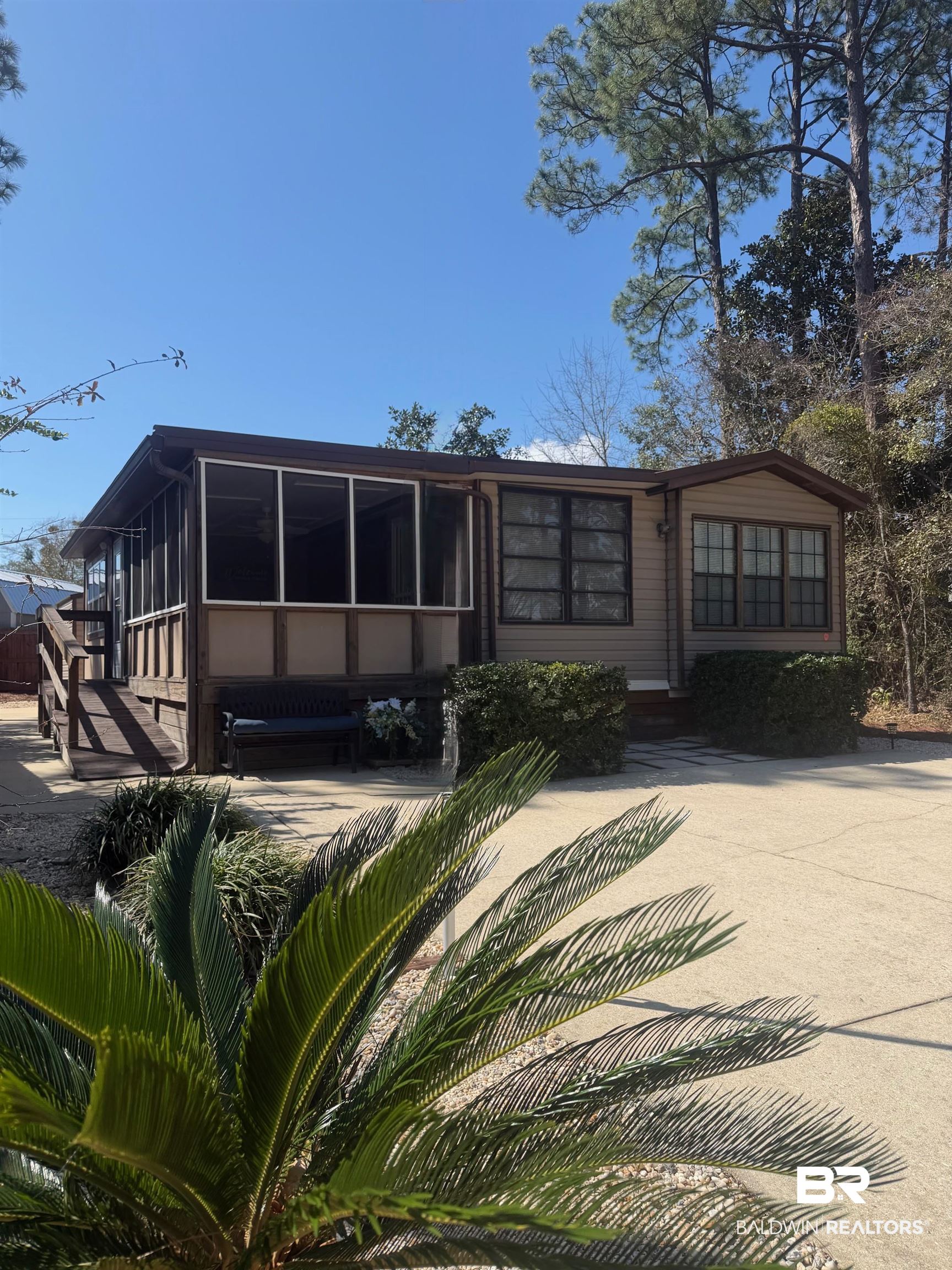 685 Escambia Loop Lillian, AL 36549 - Photo 1 of 43 View of front of house with a sunroom