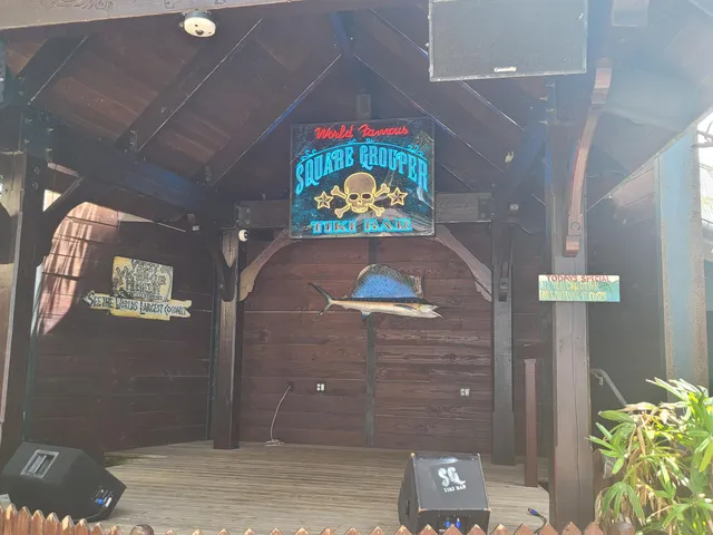 a front view of a building with sitting area