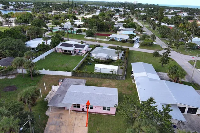 an aerial view of a house with a garden