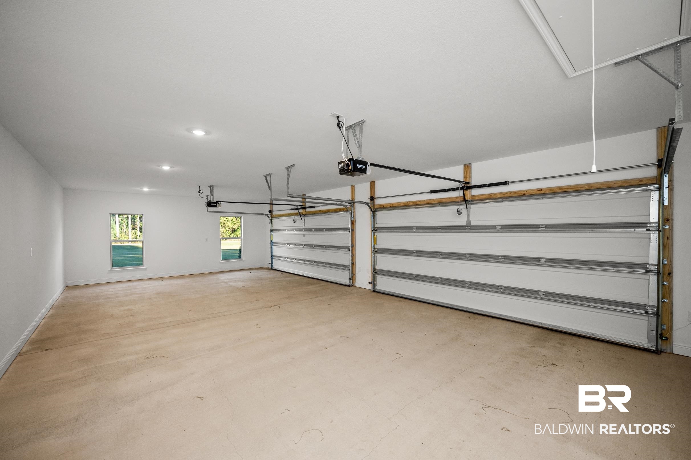 12833 Ward Road West Stapleton, AL 36578 - Photo 22 of 27 Garage featuring a garage door opener and recessed lighting
