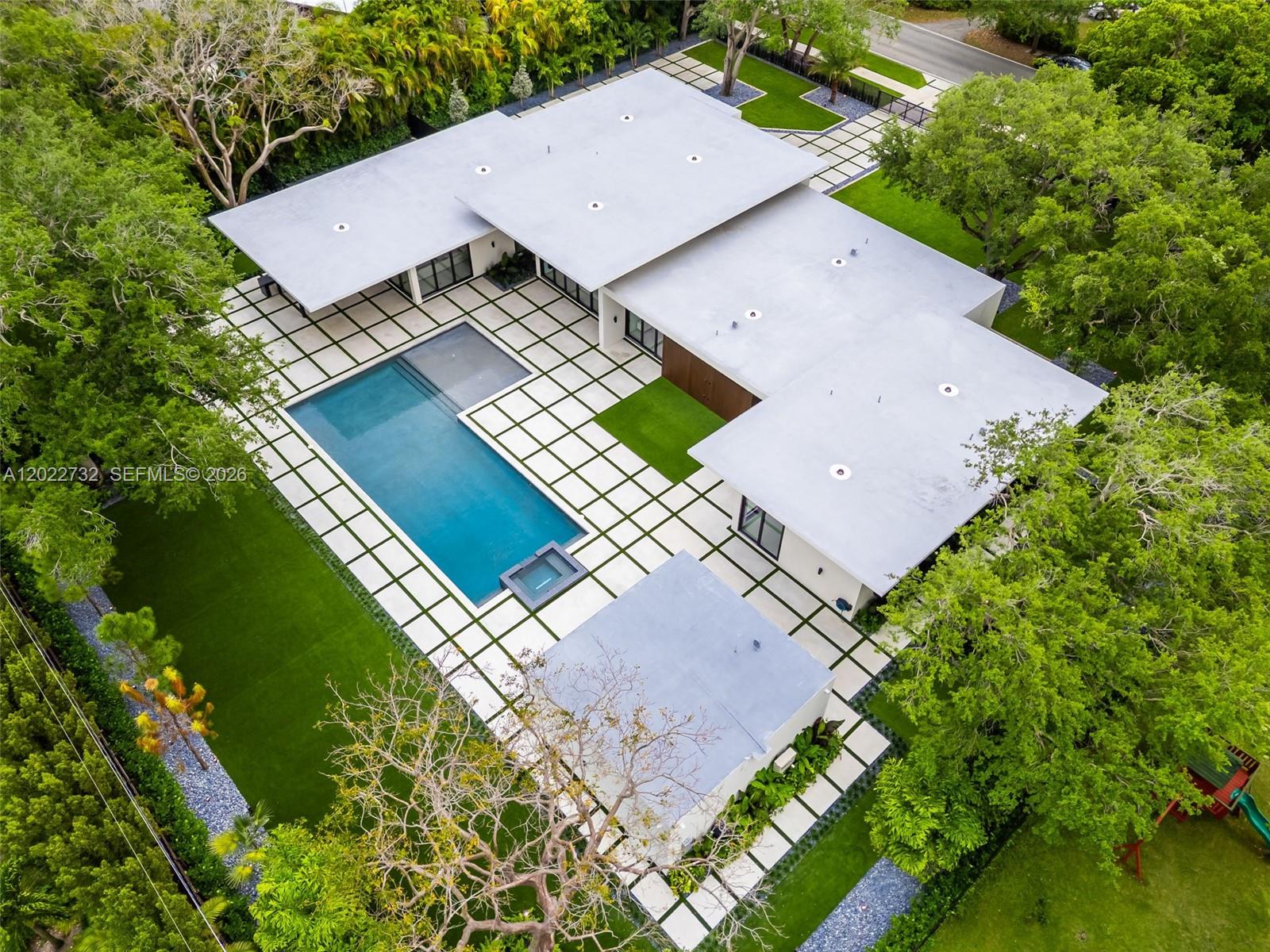 7825 Southwest 128th Street Pinecrest, FL 33156 - Photo 69 of 88 an aerial view of a house