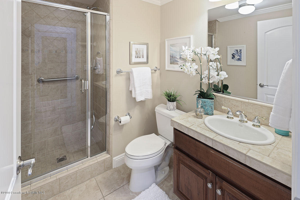 7215 Summitrose Street Tujunga, CA 91042 - Photo 24 of 47 a bathroom with a sink a toilet and shower