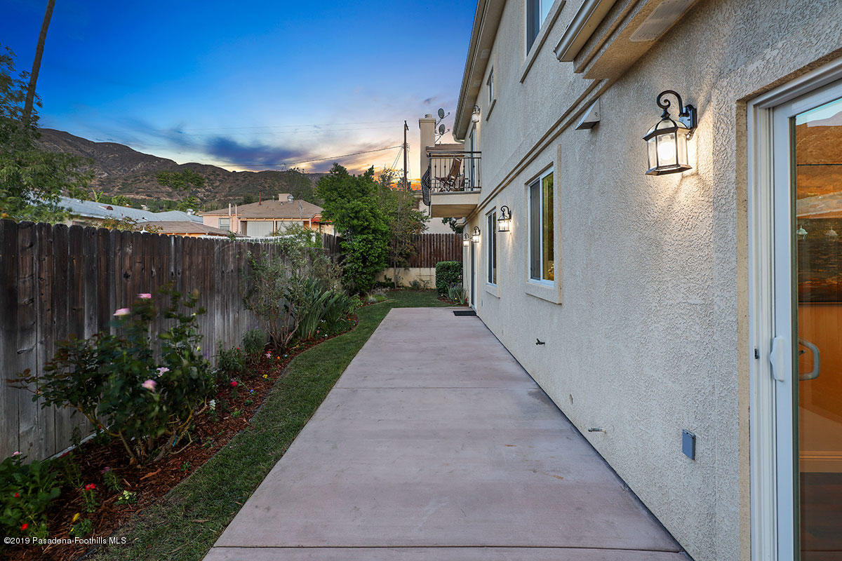 7215 Summitrose Street Tujunga, CA 91042 - Photo 44 of 47 a view of a pathway both side of house