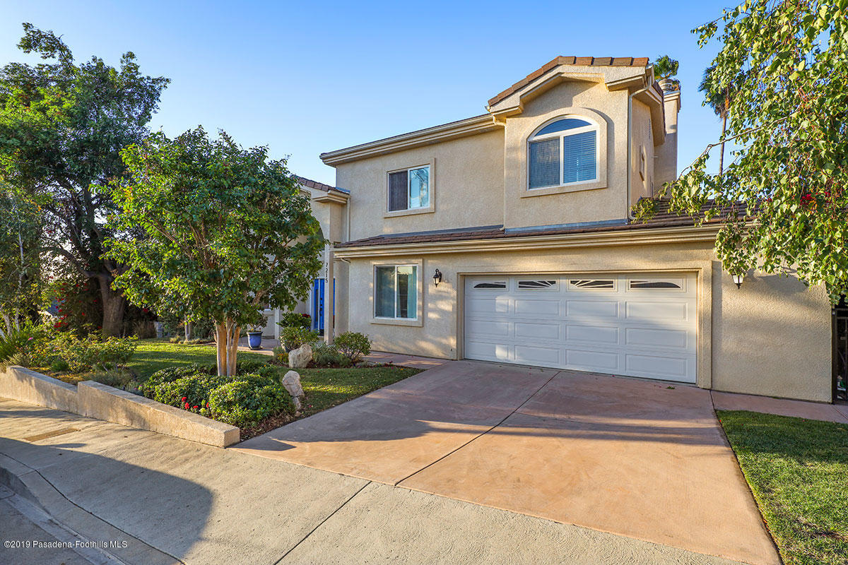 7215 Summitrose Street Tujunga, CA 91042 - Photo 46 of 47 a front view of a house with yard