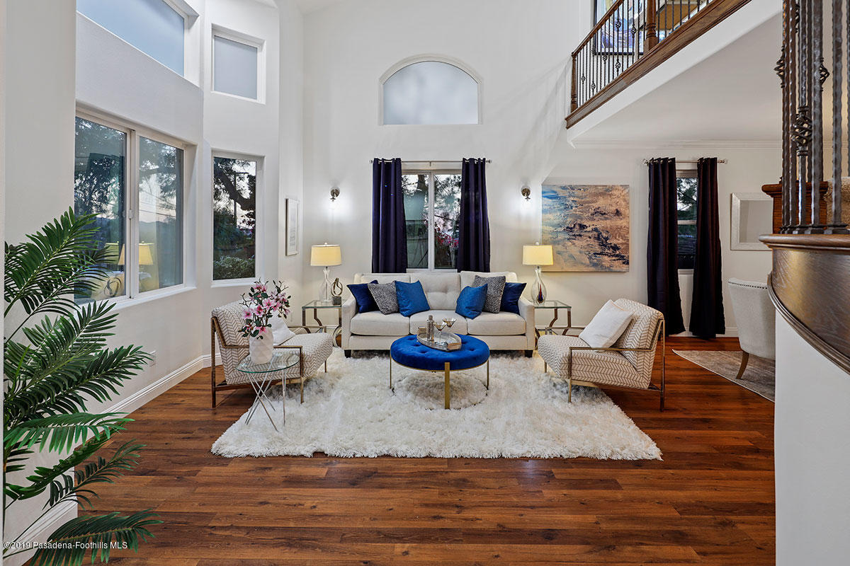 7215 Summitrose Street Tujunga, CA 91042 - Photo 7 of 47 a living room with furniture rug and a chandelier