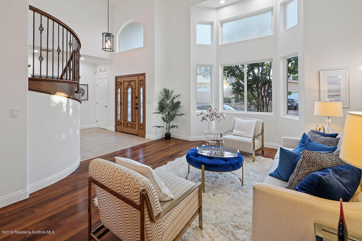 7215 Summitrose Street Tujunga, CA 91042 - Photo 10 of 47 a living room with furniture and a chandelier