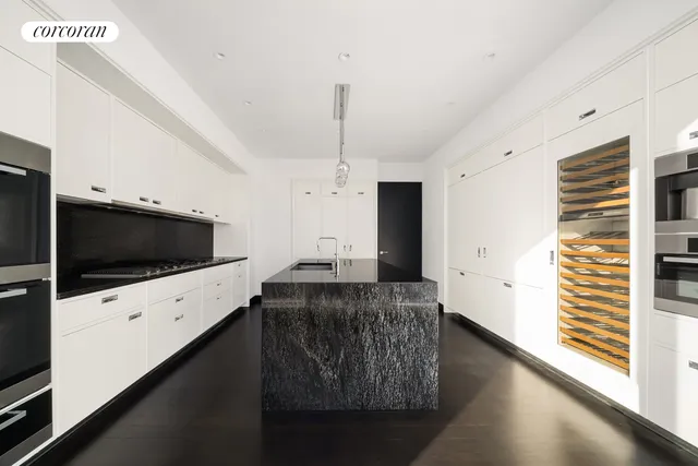 a view of a room with wooden floor and window