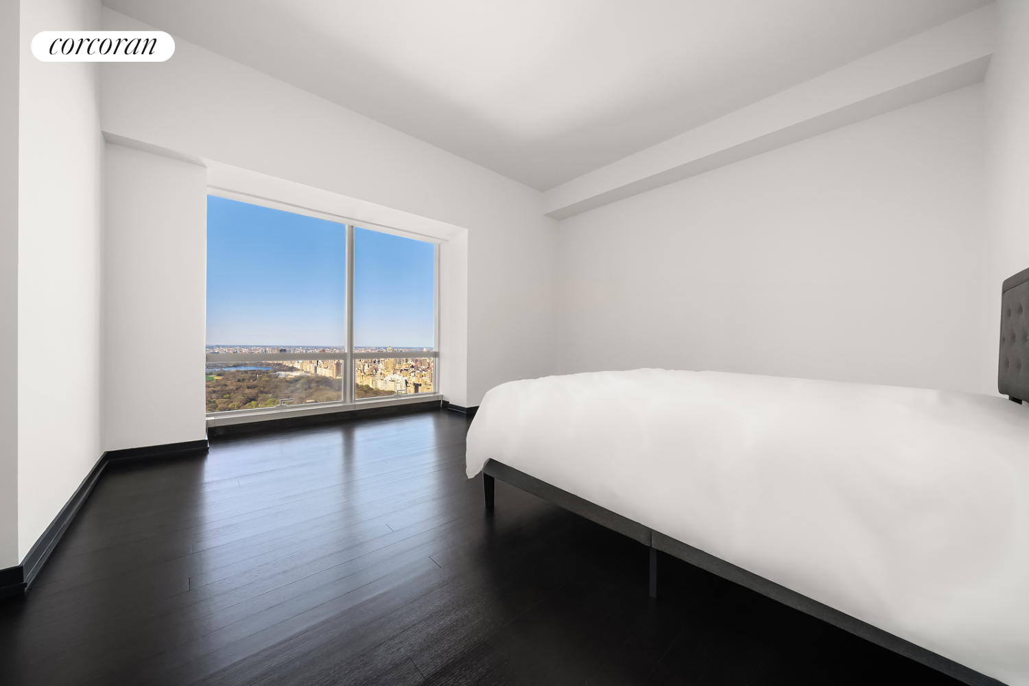 157 West 57th Street, Unit 56C Manhattan, NY 10019 - Photo 11 of 29 a view of a room with wooden floor and window