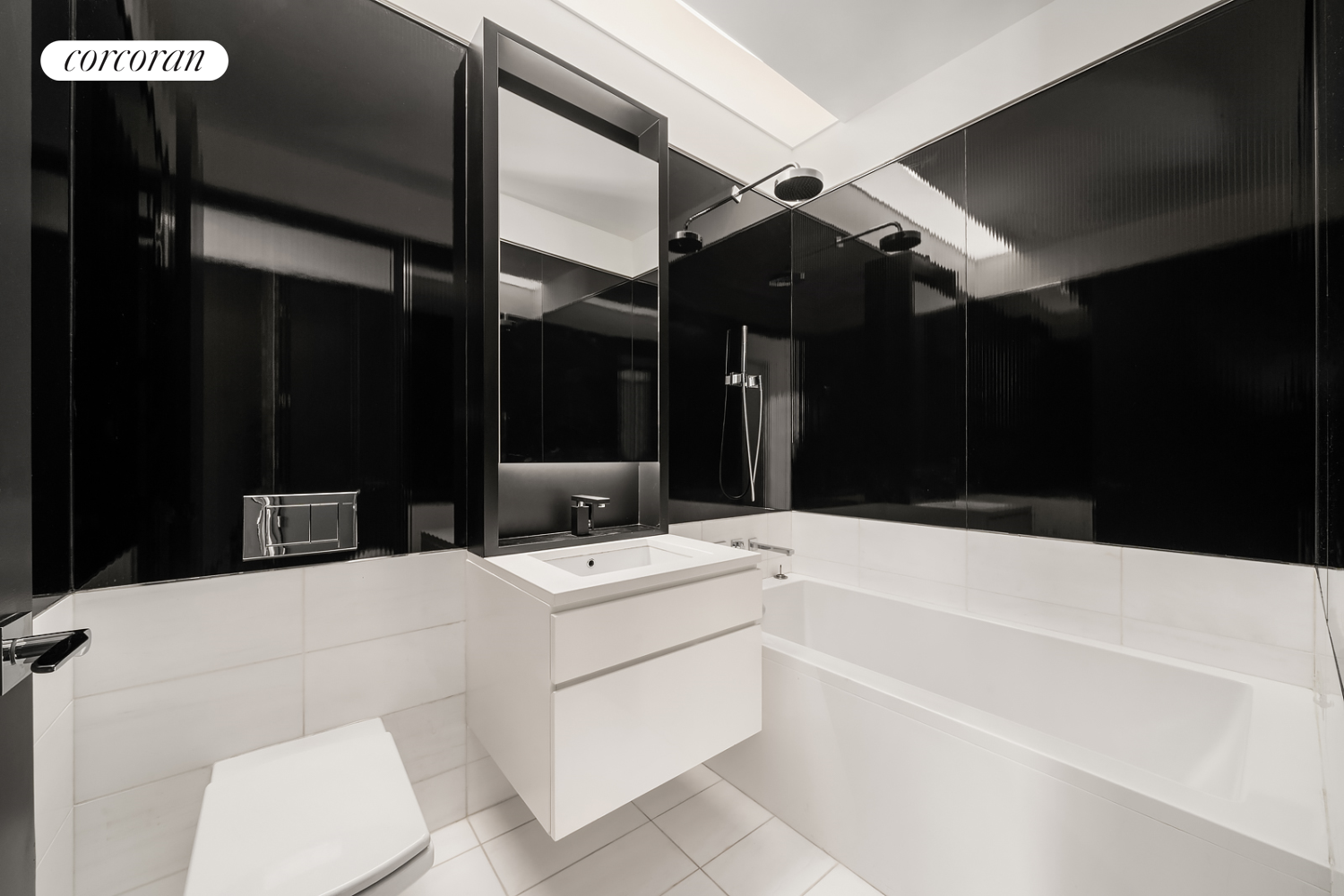 157 West 57th Street, Unit 56C Manhattan, NY 10019 - Photo 15 of 29 a bathroom with a sink a toilet and a shower