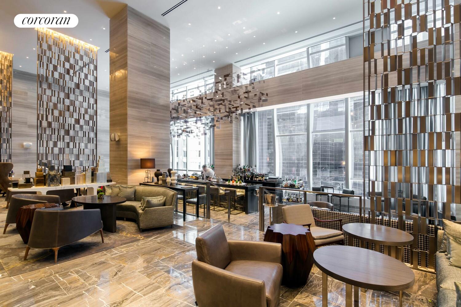 157 West 57th Street, Unit 56C Manhattan, NY 10019 - Photo 22 of 29 a living room with furniture and large windows