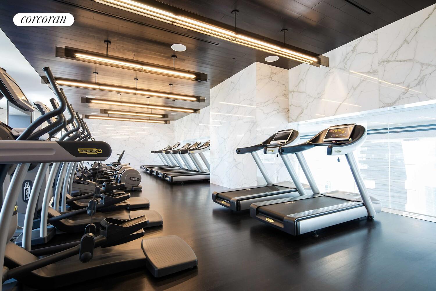 157 West 57th Street, Unit 56C Manhattan, NY 10019 - Photo 26 of 29 a view of a room with gym equipment