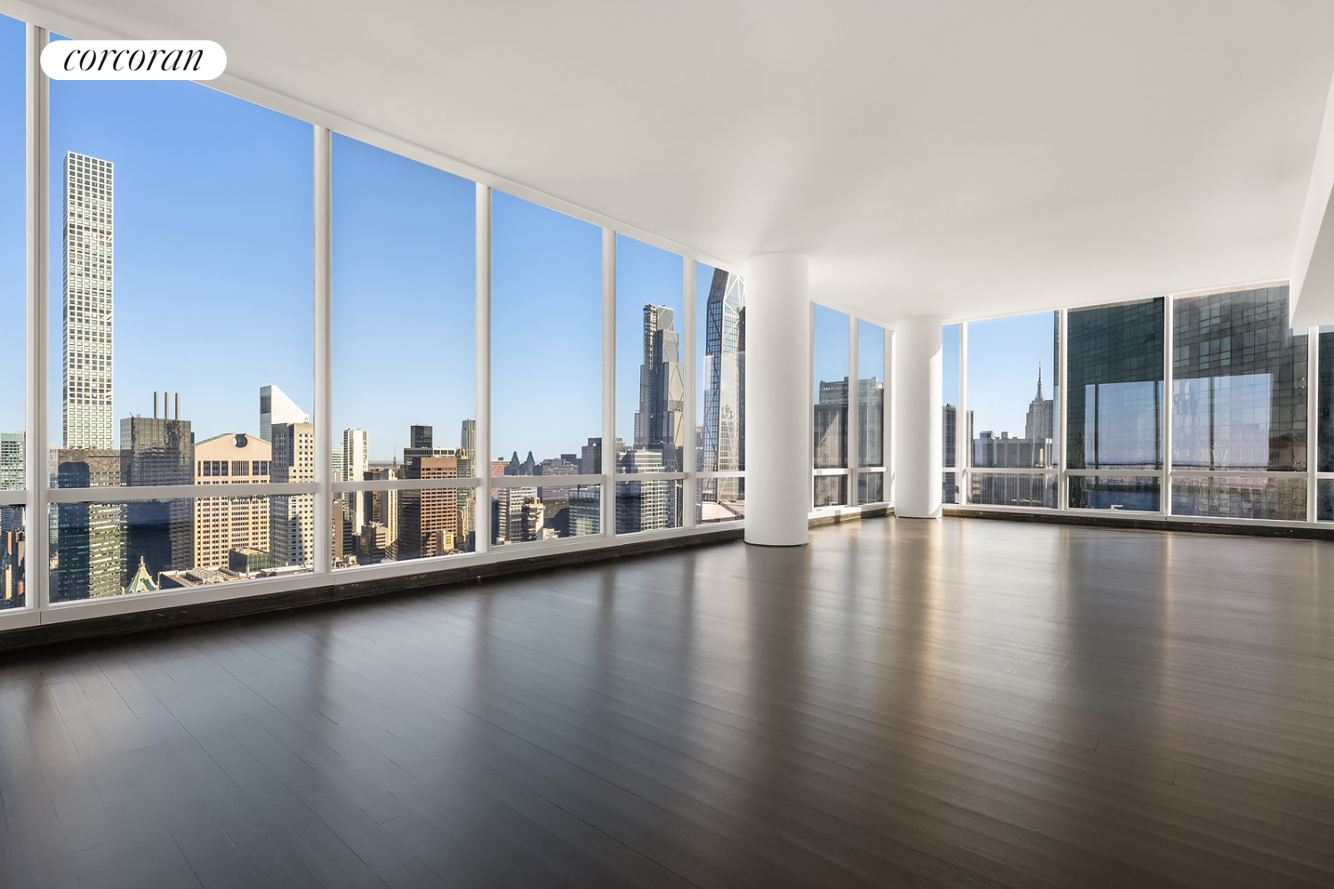 157 West 57th Street, Unit 56C Manhattan, NY 10019 - Photo 6 of 29 a view of a living room with floor to ceiling window and wooden floor