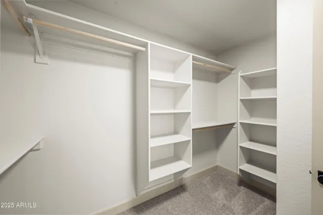 a view of an empty walk in closet
